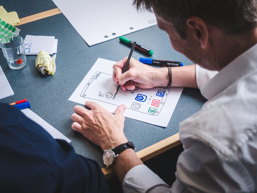 Designer sketching a mobile app screen